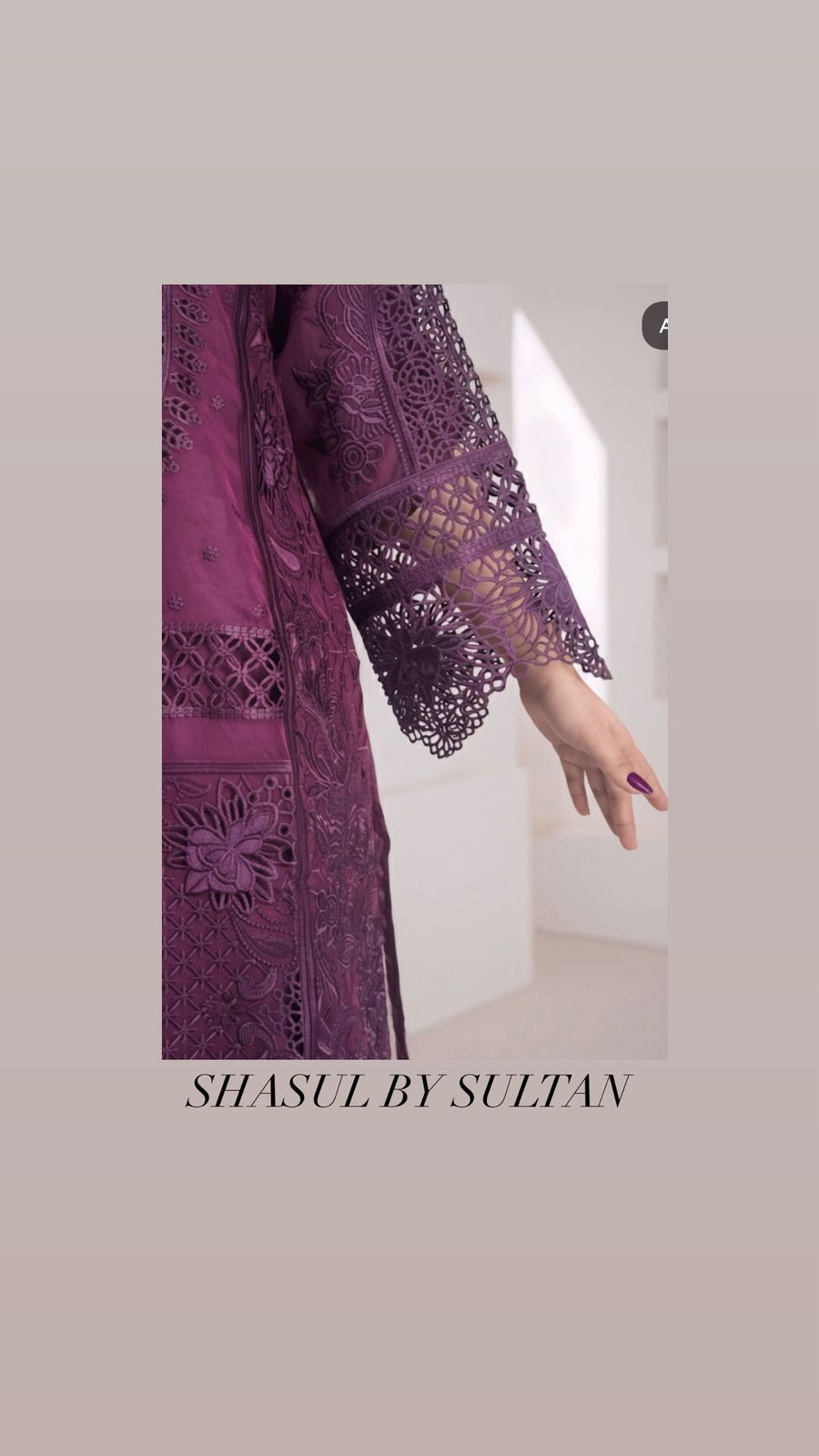 Purple embroidered garment with 'Shasul by Sultan' branding on a neutral background
