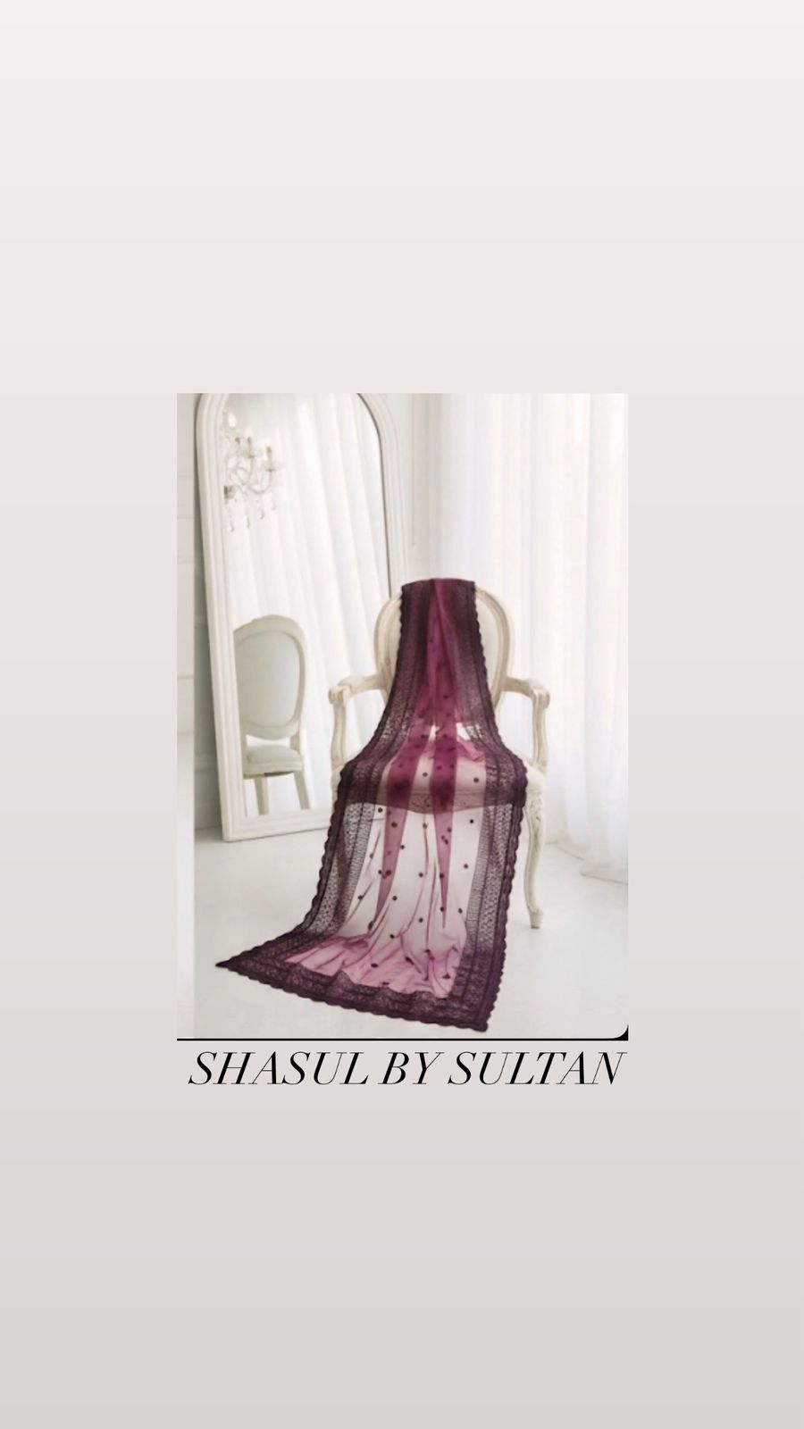 Purple lace shawl draped over a chair with 'Shasul by Sultan' branding.