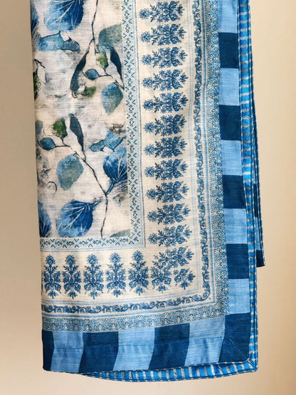 Blue and white patterned fabric with floral designs on a beige background